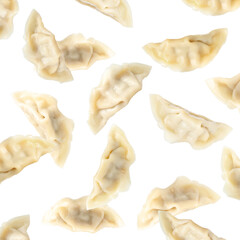 Tasty boiled gyoza (dumplings) in air on white background