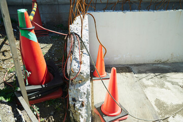 Rebar on demolished exterior wall. Rusted and bent in all directions.