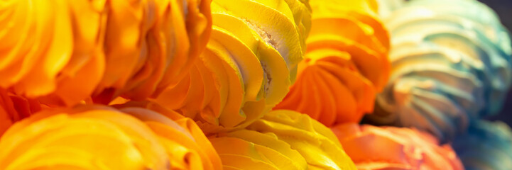 Fresh tasty multicolored meringue in showcase. Sweet Dreams. Banner. Selective focus, defocus