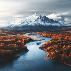 Tranquil River Flowing Towards Majestic Snow-Covered Peak Aerial View
