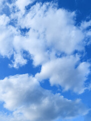 Cloudscape – White Clouds in a Bright Blue Sky, Natural Background. Blue Heaven with Clouds