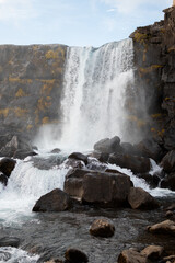 Golden Circle Waterfall cascading over rocks in iceland, creating a picturesque landscape