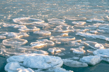 Ice-covered sea cliffs. The beauty of the winter sea.