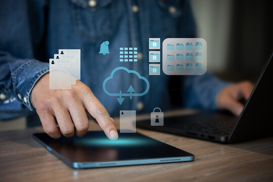 Business man work with laptop seek data input and output from cloud data icon floating on screen.