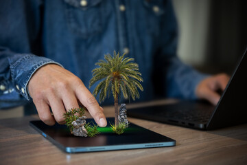 Business man work with laptop and tablet to design garden landscape