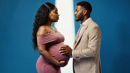 Couple shares intimate moment during pregnancy photoshoot in a studio setting - Powered by Adobe