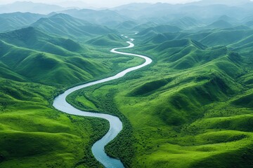 Serpentine River Winding Through Lush Green Mountains Aerial View