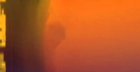 Abstract blurred film texture background with grain, dust and light leak. 