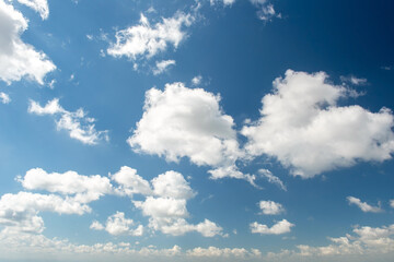 A blue sky with white cloud background.