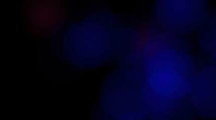 Abstract background with soft, blurred blue and purple lights creating a dreamy bokeh effect.