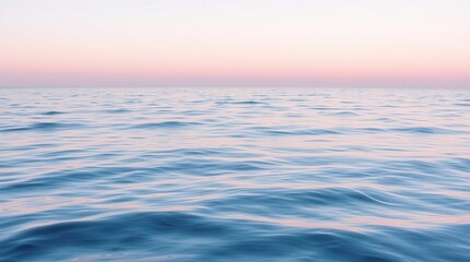 Obraz premium Pastel hues paint the tranquil ocean surface, creating a serene and dreamy seascape.