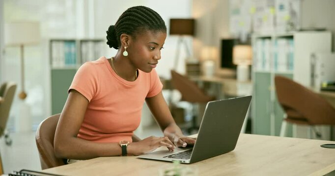 Typing, report and black woman in office with laptop for SEO, copywriting and online social media research. Employee, working and writing a blog, review or article on the internet or content creation