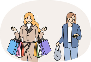 Obraz premium Problem of social inequality between rich woman with bags from supermarket and poor girl with coins in hand. Social inequality causes stress for lady in need of improved financial literacy