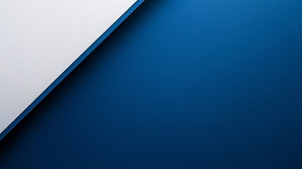 White laptop computer on a minimalist navy blue background with modern aesthetic design