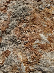 Geological formation displaying rich textures and earthy colors at a natural location