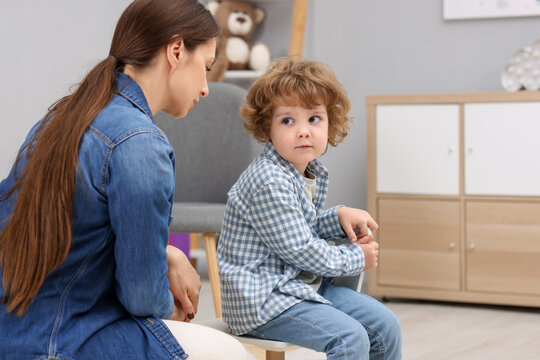 Resentful little boy and his mother arguing at home - Powered by Adobe