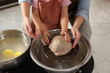 Hobby and craft. Mother with her daughter making pottery indoors, closeup