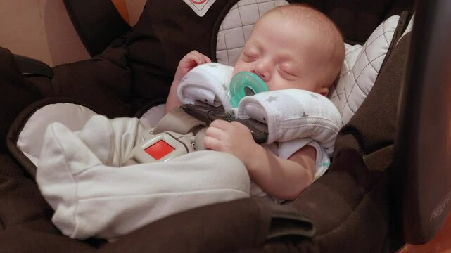 Infant Baby Boy Sleeping in Carseat