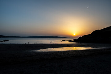 Fototapeta premium Sunset On On Pwllgwaelod Beach And Dinas Head At The Wild Atlantic Coast Of Pembrokeshire In Wales, United Kingdom