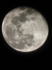 Full moon in dark sky, space view