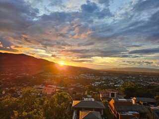 Sunset Over Cityscape: Beautiful Evening Glow