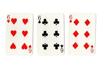 Playing cards showing three of the same value on a white background.