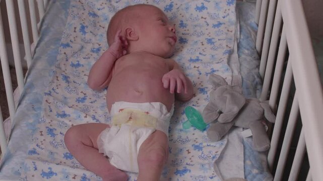Newborn Infant Crying in Crib
