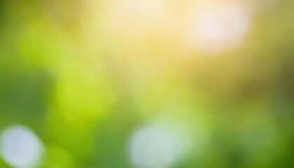 Obraz premium soft focus green and yellow sunlight bokeh background with natural blurred foliage, ideal for eco friendly designs and wellness themes