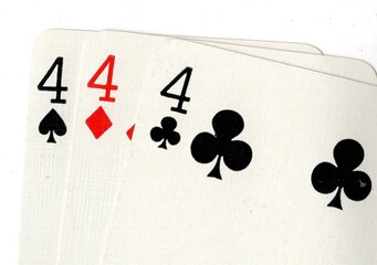 A close up of vintage playing cards isolated on a white background.
