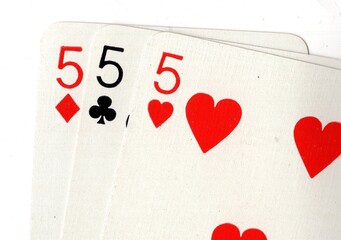 A close up of vintage playing cards isolated on a white background.