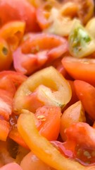 Sliced ​​tomatoes for background. Prepare tomatoes for cooking.