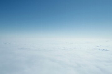 Obraz premium Expansive View of Clouds from High Altitude under Clear Blue Sky Capturing Serenity and Tranquility with a Blend of Soft Whites and Vivid Blues