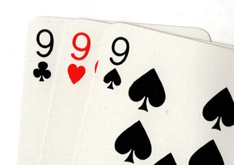 Close up of a hand of playing cards on a white background.