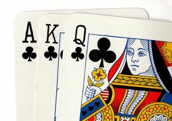 Close up of a hand of playing cards on a white background.