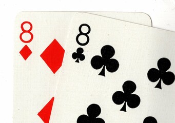 Close up of a hand of playing cards on a white background.