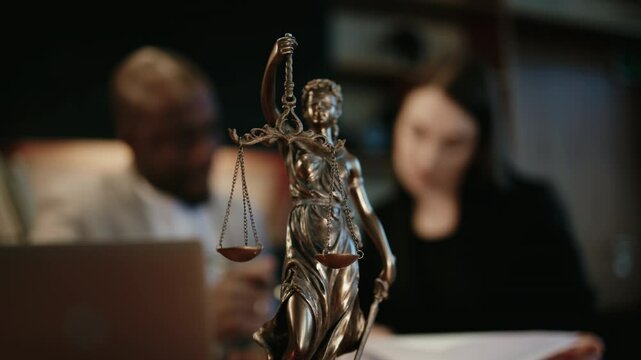 A lawyer or attorney consults a client in the evening in a modern office, offering professional legal services. Concept trust, expertise, and the importance of personalized approach.