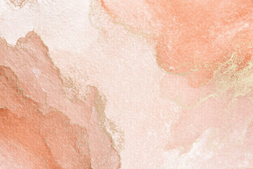 Pink and gold alcohol ink painting creates an elegant and abstract texture, perfect for backgrounds and design projects