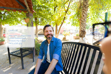High-tech glasses projecting digital overlays onto adult man resting on urban park bench