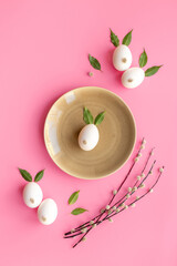Plate with Easter bunny made of eggs and willow buds. Happy Easter concept