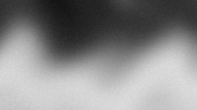 An abstract neutral black and white mottled grainy grunge texture motion graphic background loop design.