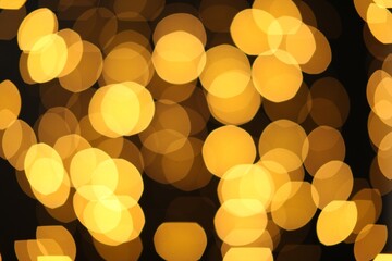 Blurred view of golden lights on dark background. Bokeh effect