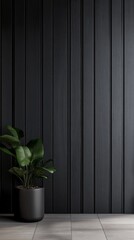 A sleek black wooden wall panel sets a sophisticated backdrop, complemented by a stylish pot with vibrant green foliage. This elegant arrangement enhances modern interior aesthetics
