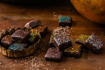 chocolate pieces artistically arranged on wood 