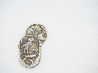 Greek silver coins, Athenian owl and Aegina turtle.