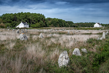 Ancient Stone Field Alignements De Menhir Carnac With Neolithic Megaliths And Old Cottage In Brittany, France
