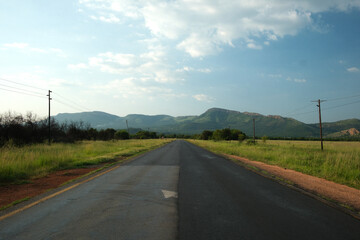 straight road heading towards mountains