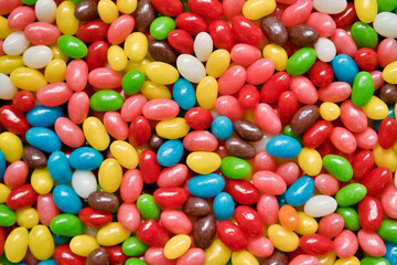Colorful chewable candies as a bright background. Lots of multicolored candies close-up for sale in the store.