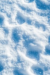 Natural snow texture. The surface of the snow crust. Snowy ground. Winter background with snow patterns. Perfect for Christmas and New Year design. Closeup top view.