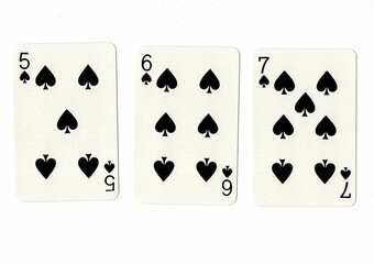 A hand of playing cards showing a run of three in the same suit.