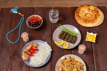 Set table Ramadan iftar Eid al fitr dolma, khinkad, bulgur with meat, dates
